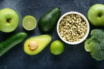 a selection of green fruits and vegetables